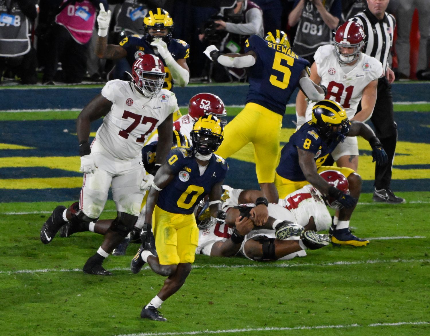 Jan 1, 2024; Pasadena, CA, USA; Michigan Wolverines defensive back Mike Sainristil (0) celebrates the Wolverines overtime win over Alabama Crimson Tide in the 2024 Rose Bowl college football playoff semifinal game at Rose Bowl.